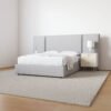 Grey custom upholstered bed with extended headboard UAE